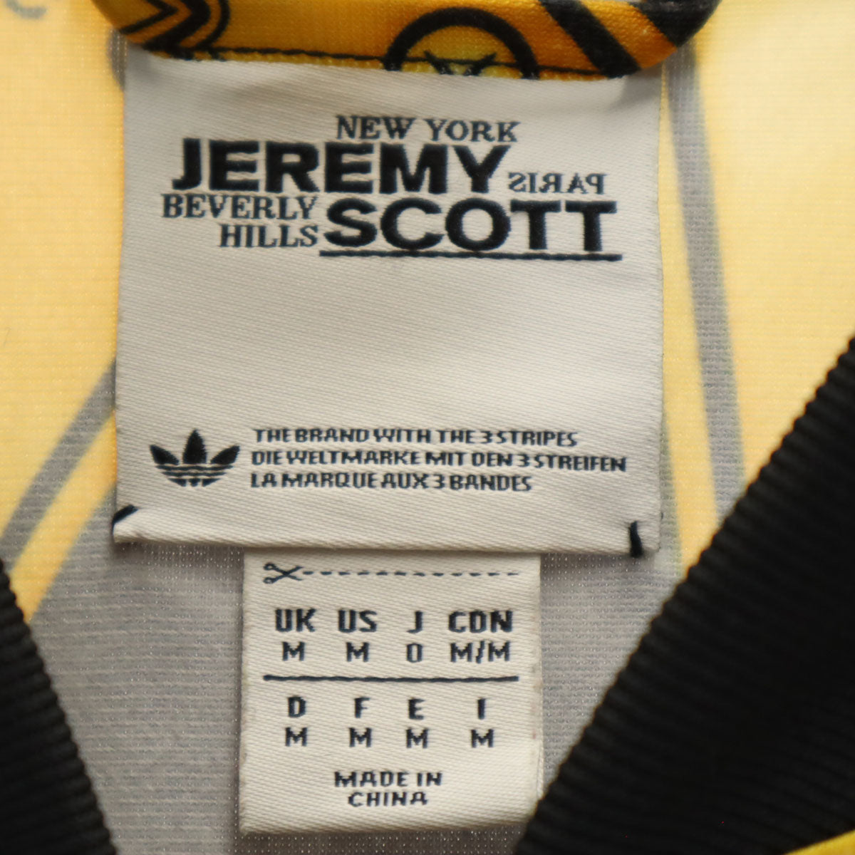 adidas Originals アディダスオリジナルス JEREMY SCOTT ジェレミースコット コラボライン 10周年記念 ゴールドプレート総柄 トラックジャケット O ブラック ジャージ レディース