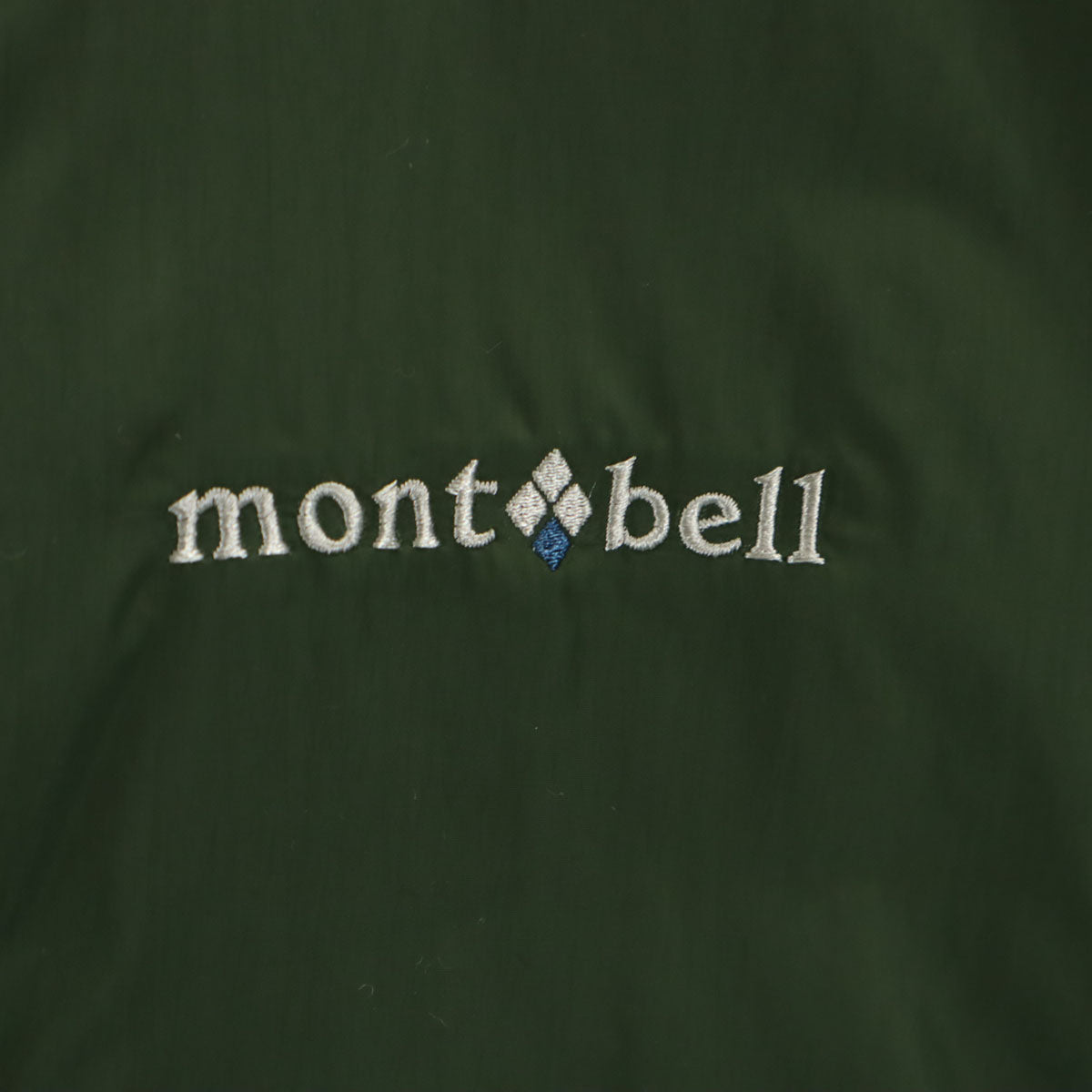 未使用 mont-bell モンベル サーマランド 中綿ジャケット L グリーン 収納袋付き リバーシブル メンズ