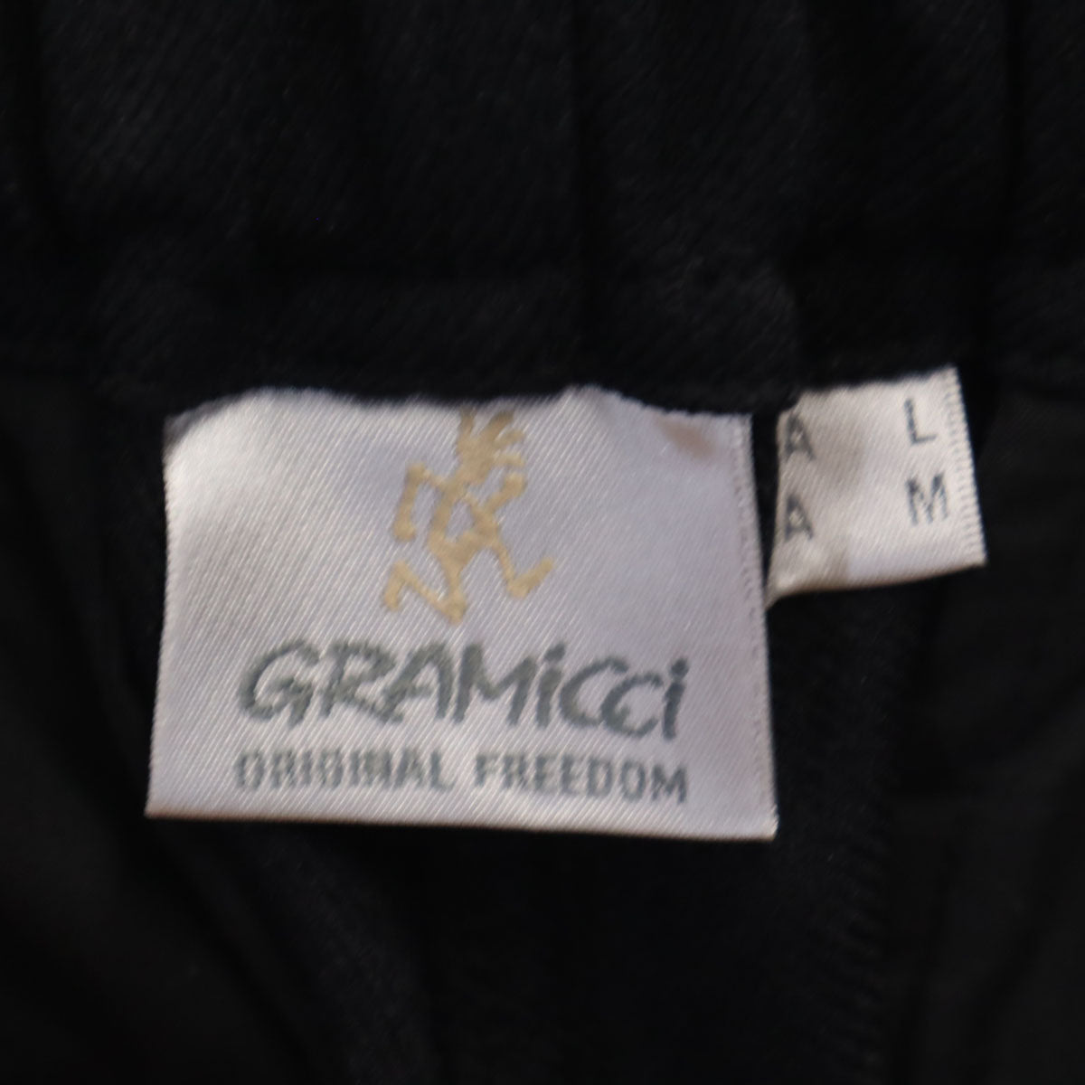 Gramicci グラミチ ウーリーストレッチルーズ テーパードパンツ L ブラック アウトドア メンズ