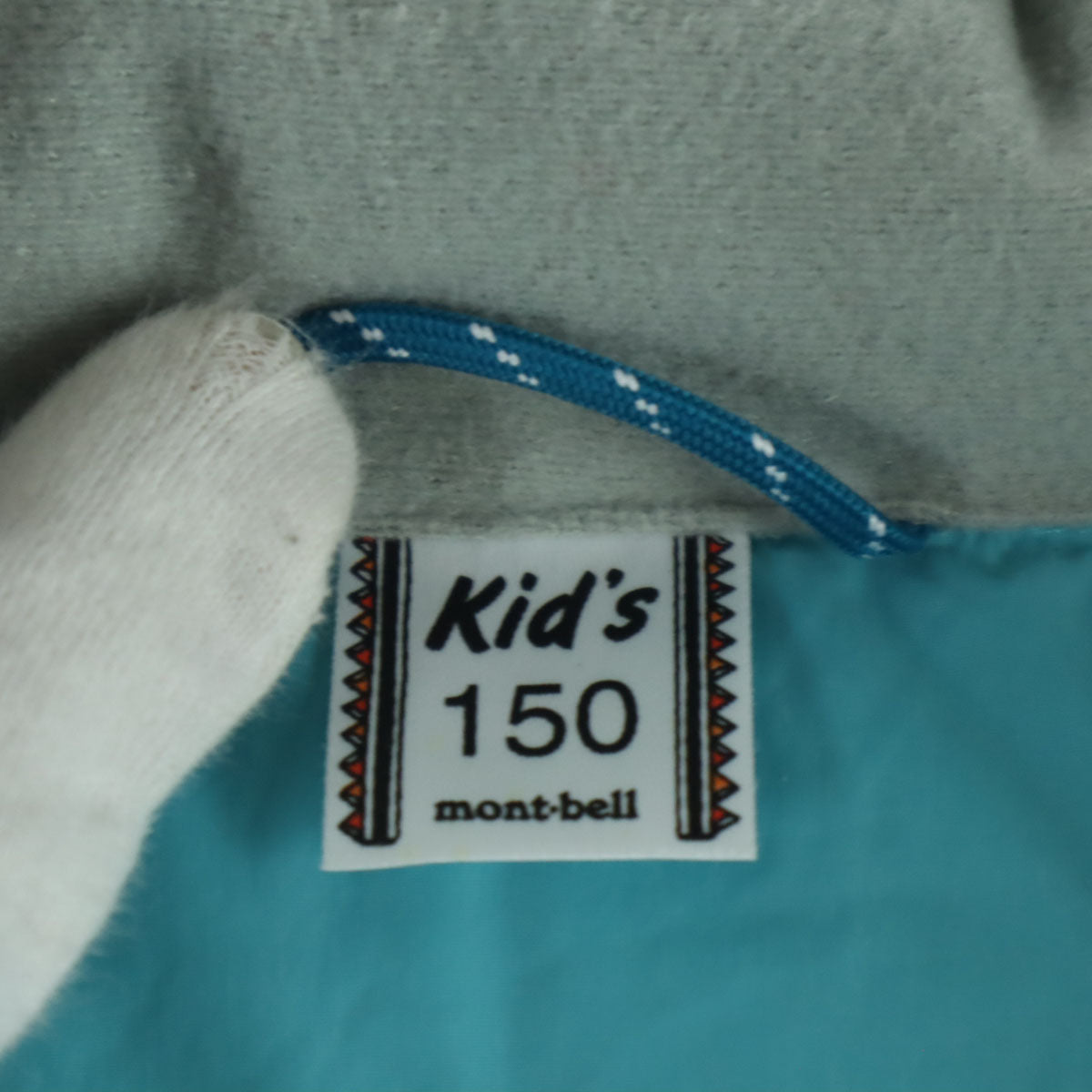 美品 mont-bell モンベル 英字 長袖 ダウンジャケット 150 ライトブルー フード取り外し可 収納袋付属 キッズ