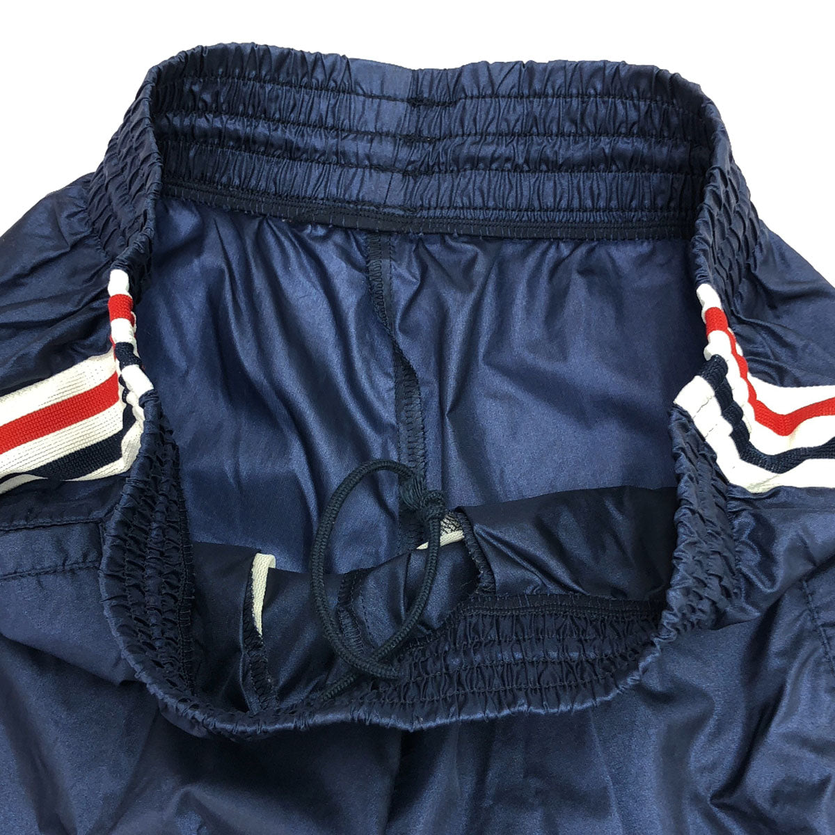 adidas アディダス 90s 日本製 デサント AS-4713P オールド ロゴプリント ナイロンパンツ M-L ネイビー系 ウィンドパンツ 裾リブ ZIP ウエストゴム トレーニング メンズ