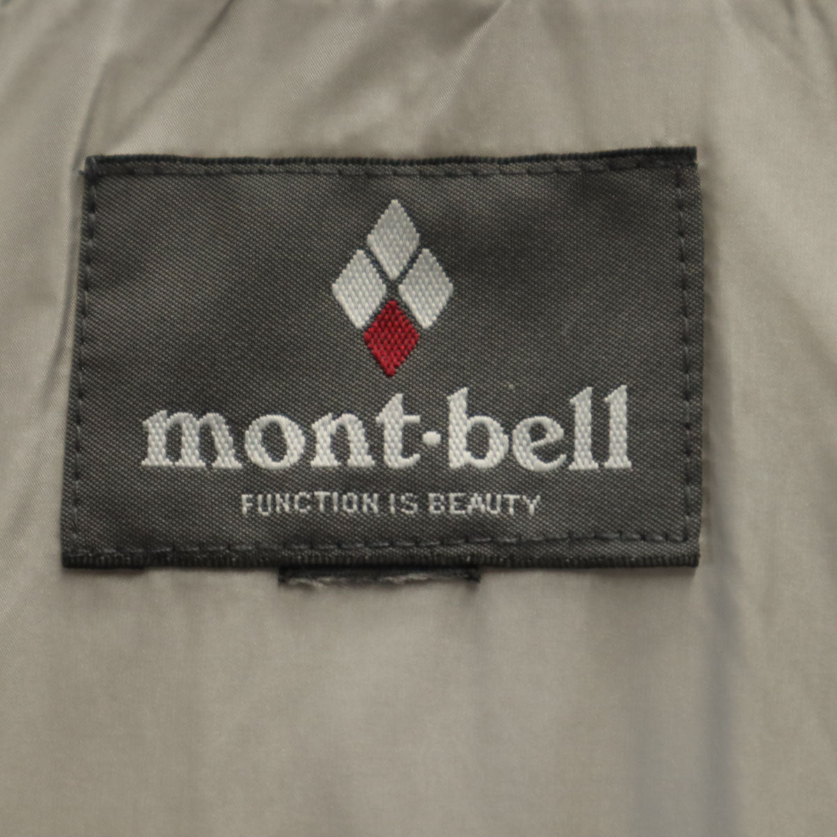 mont-bell モンベル トラベル ダウンパーカー ライトグレー アウトドア 収納袋付き レディース