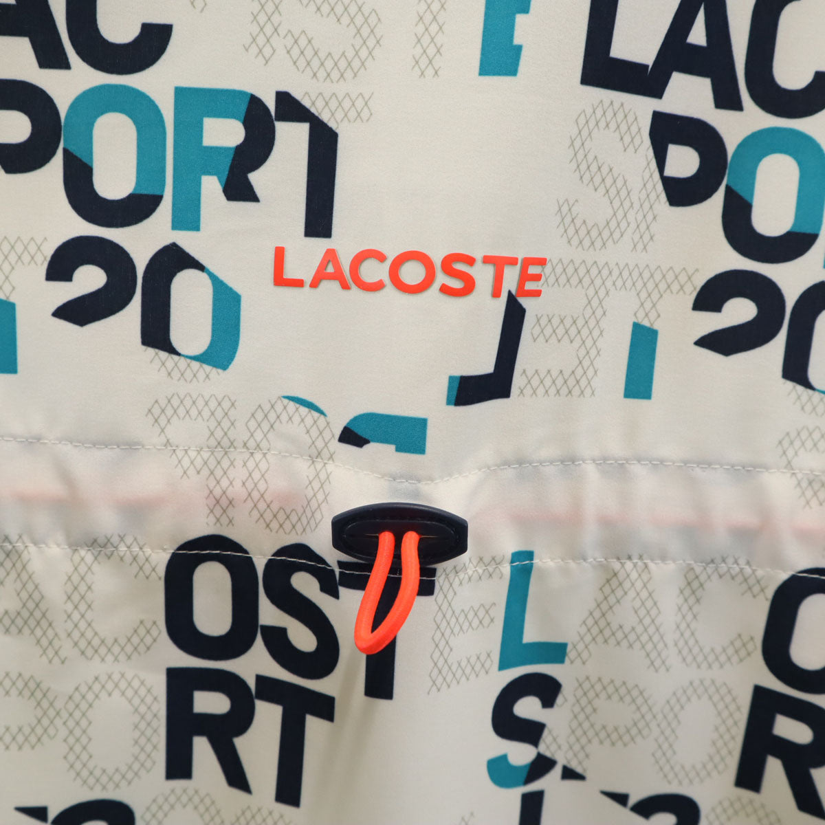 LACOSTE SPORT ラコステスポーツ 総柄 ジップジャケット 38 ホワイト系 レディース