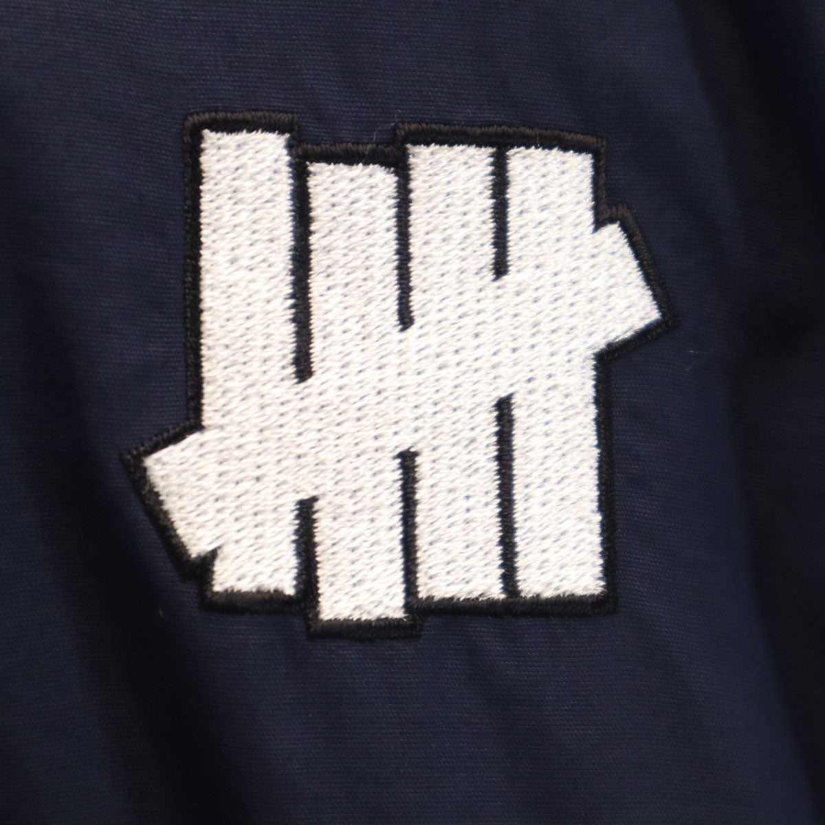 Champion チャンピオン UNDEFEATED アンディフィーテッド コラボ アノラックパーカー L ネイビー メンズ